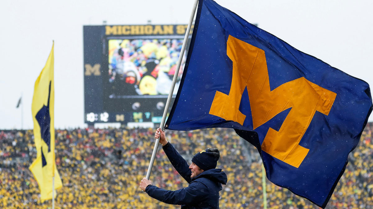 Connor Stalions Michigan spirit squad celebrates a touchdown against Ohio State during the first half at Michigan Stadium in Ann Arbor on Saturday, Nov. 27, 2021. michigan football stock u-m logo, Michigan flag, Michigan banner