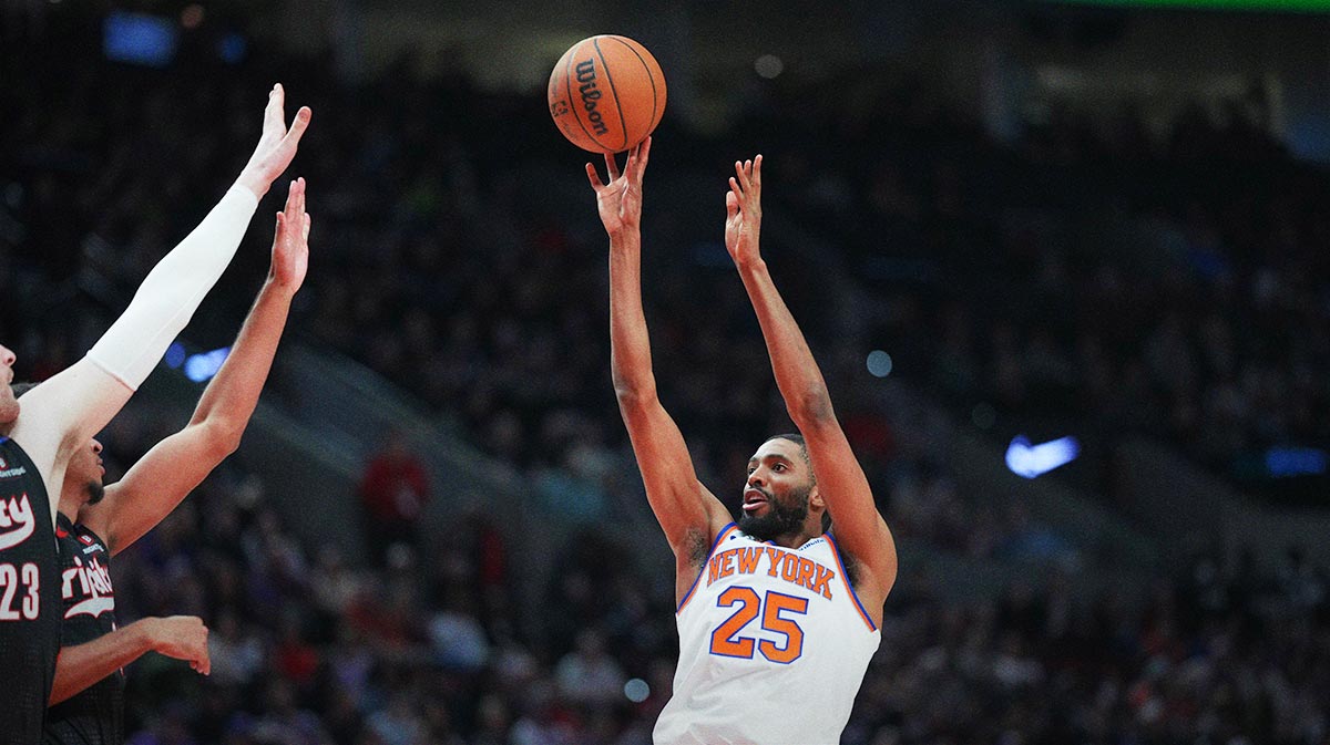 New York Knicks Small forward Mikal Bridges (25) Bows the ball via Portland Trail Blazers Center Donovan Clingan (23) and preserve Raian Rupert (21) during the second half in the Moda Center.