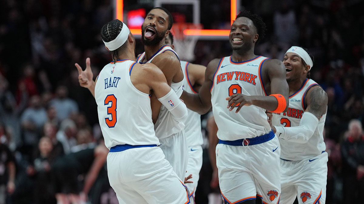 The little New York Knicks, Mikal Bridges (25), celebrate with teammates after firing extension against the Portland Trail Blazers at Moda Center.