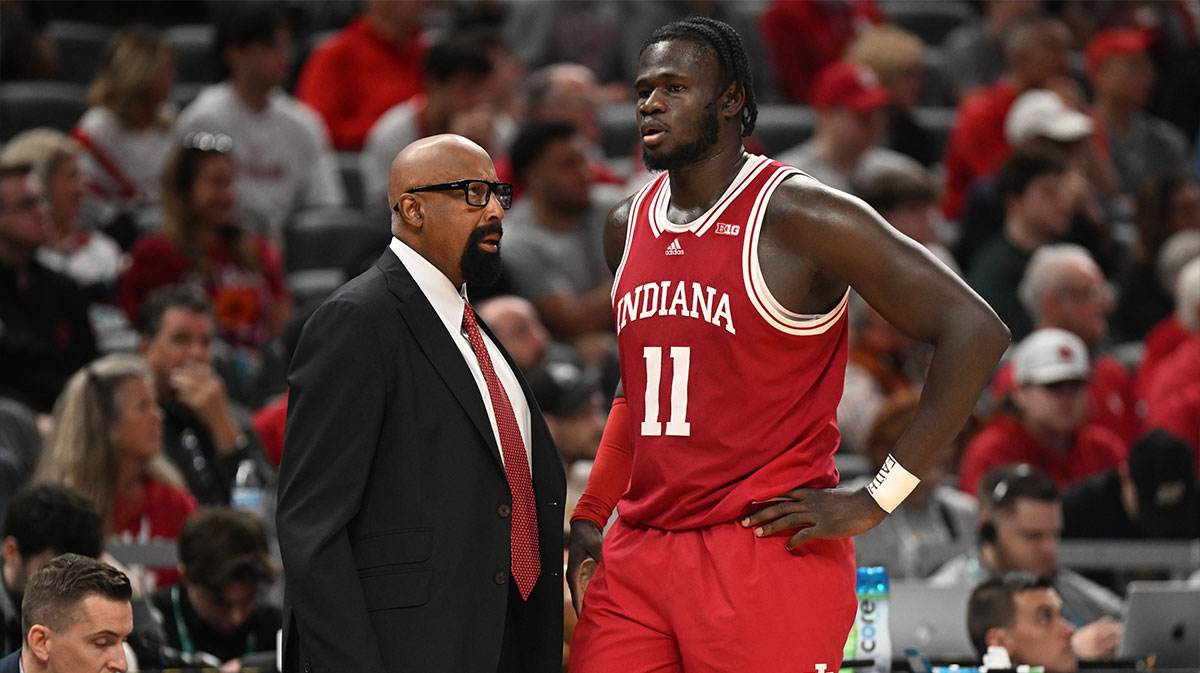Indiana Hoosiers head coach Mike Woodson talks with Indiana Hoosiers center Oumar Ballo (11) during the second half against the Oregon Ducks at Gainbridge Fieldhouse.