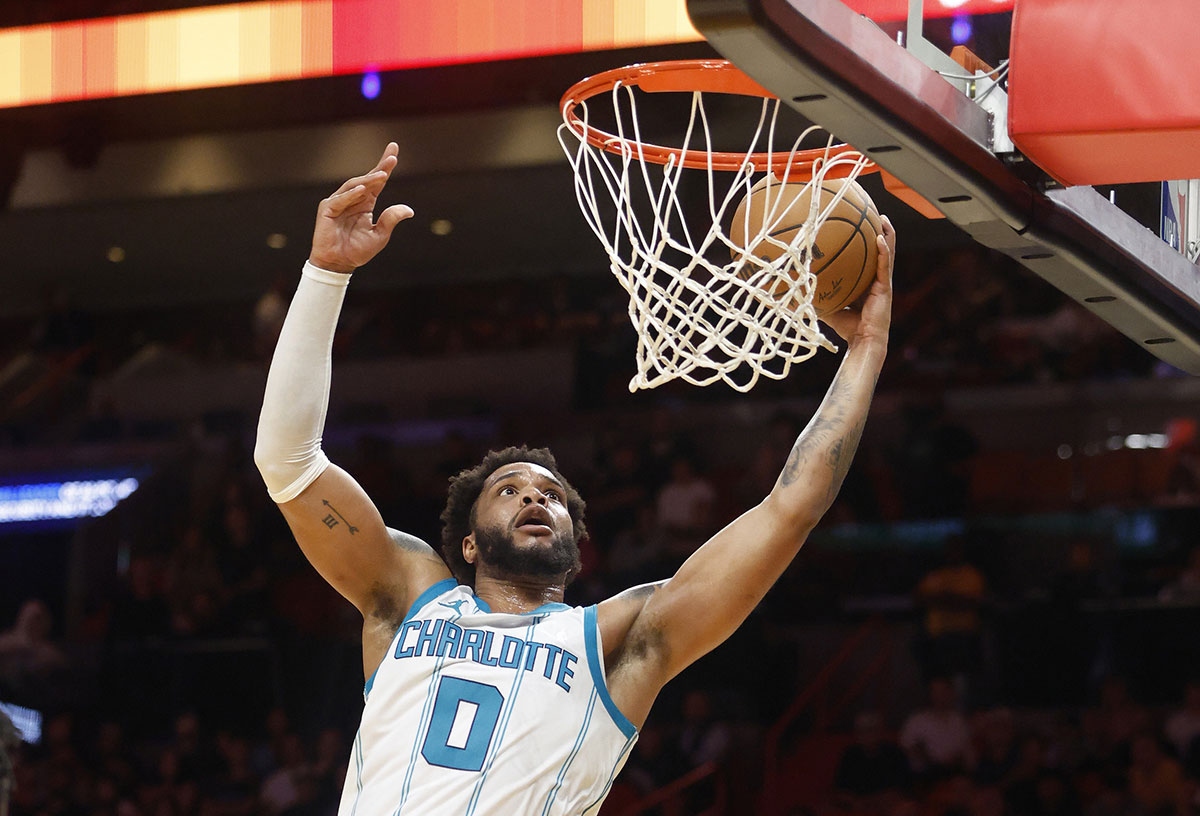 Charlotte Hornets Forward Miles Bridges (0) Dunks against Miami Heat during the first half at Kaseya Center