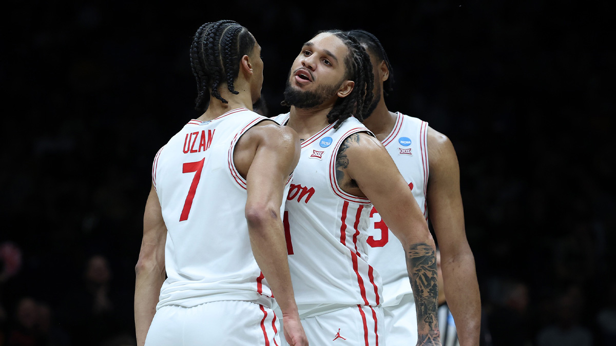 Houston Cougars guard Milos Uzan (7) reacts with guard Emanuel Sharp (21) against the Purdue Boilermakers in the second half during a Midwest Regional semifinal of the 2025 NCAA tournament at Lucas Oil Stadium.