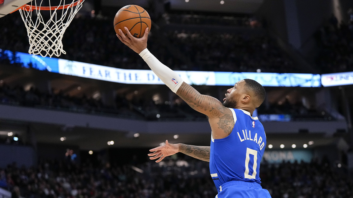 Milvaukee Bucks Guard Damian Lillard (0) shoots during the third quarter against Indiana Pacer at Fiserv Forum.