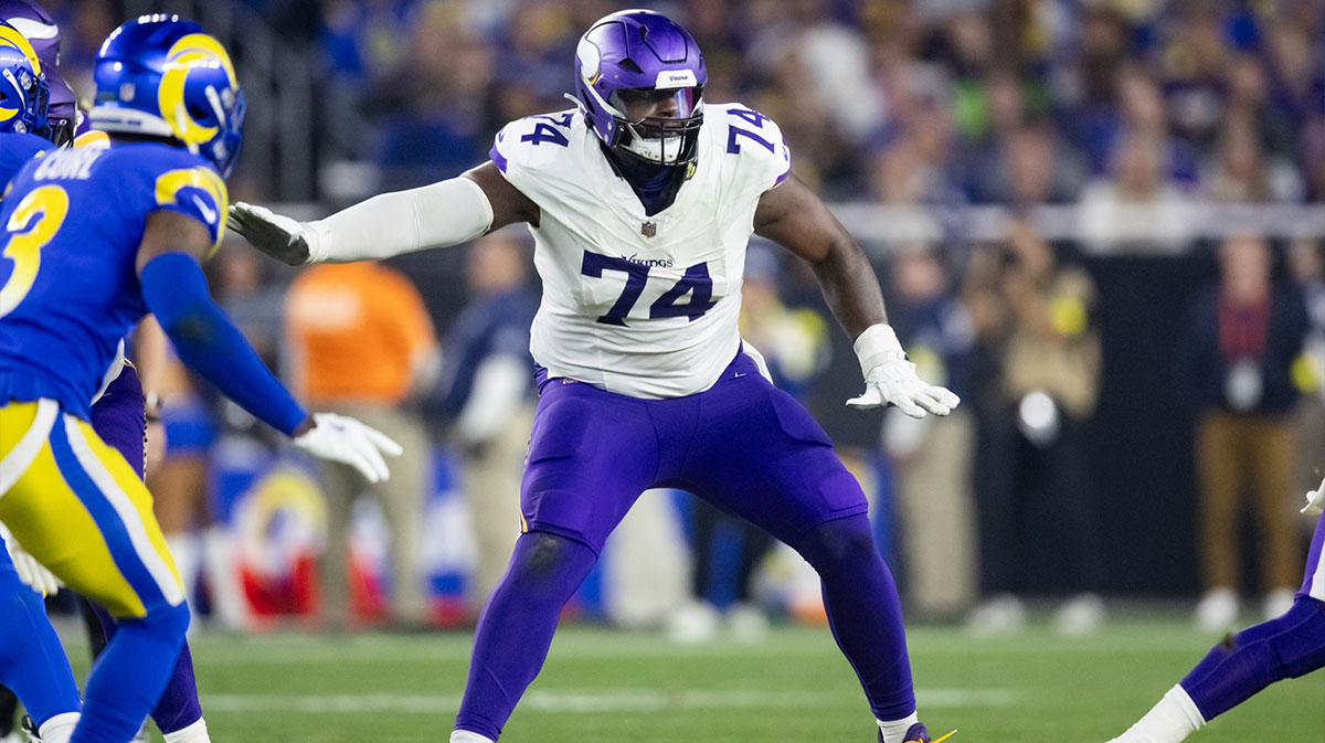 Minnesota Vikings tackle Cam Robinson (74) against the Los Angeles Rams during an NFC wild card game at State Farm Stadium.