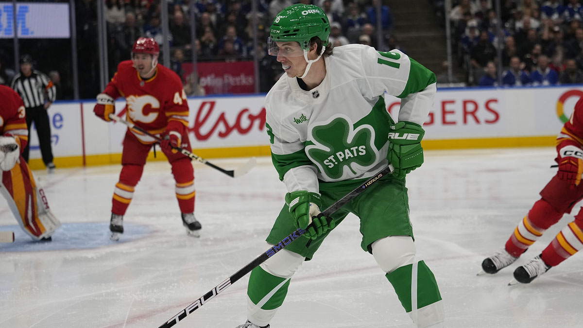 Toronto Maple Leafs forward Mitch Marner (16) looks for the puck against the Calgary Flames during the first period at Scotiabank Arena. 