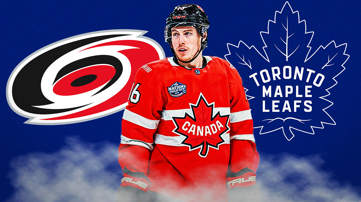Mitch Marner with Hurricanes logo behind to left and Maple Leafs behind to right