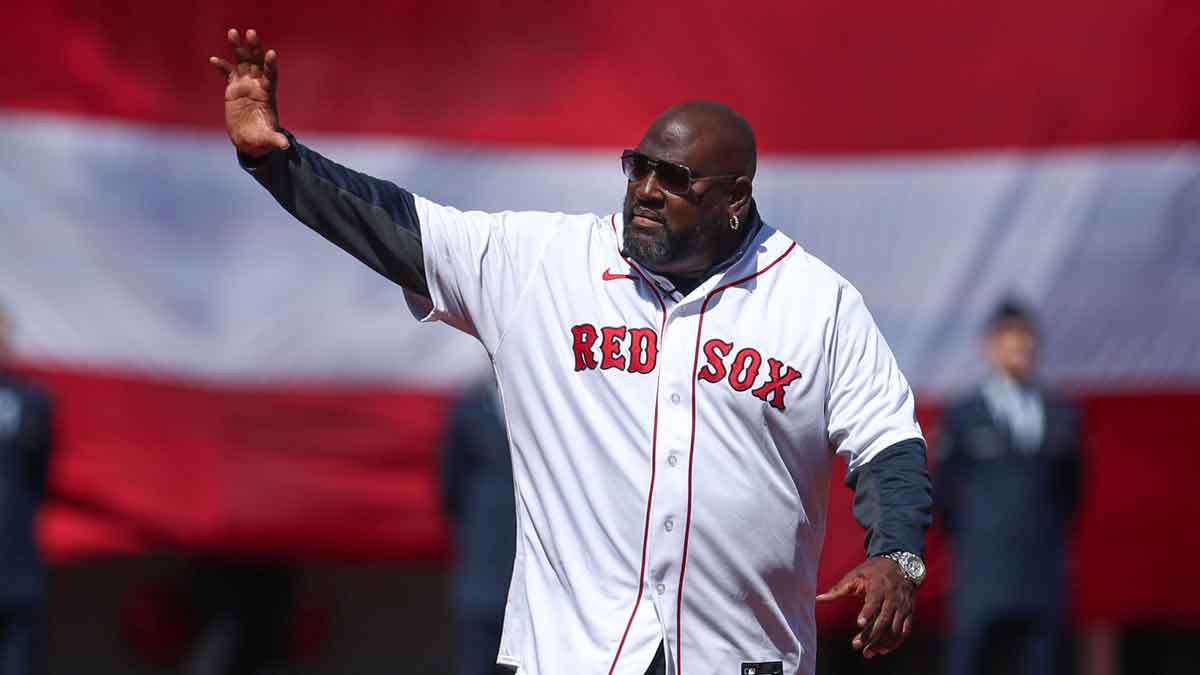 Former Boston Red Sox player Mo Vaughn (42) waves to the crowd at Fenway Park. Every player is wearing number 42 in honor of Jackie Robinson. 