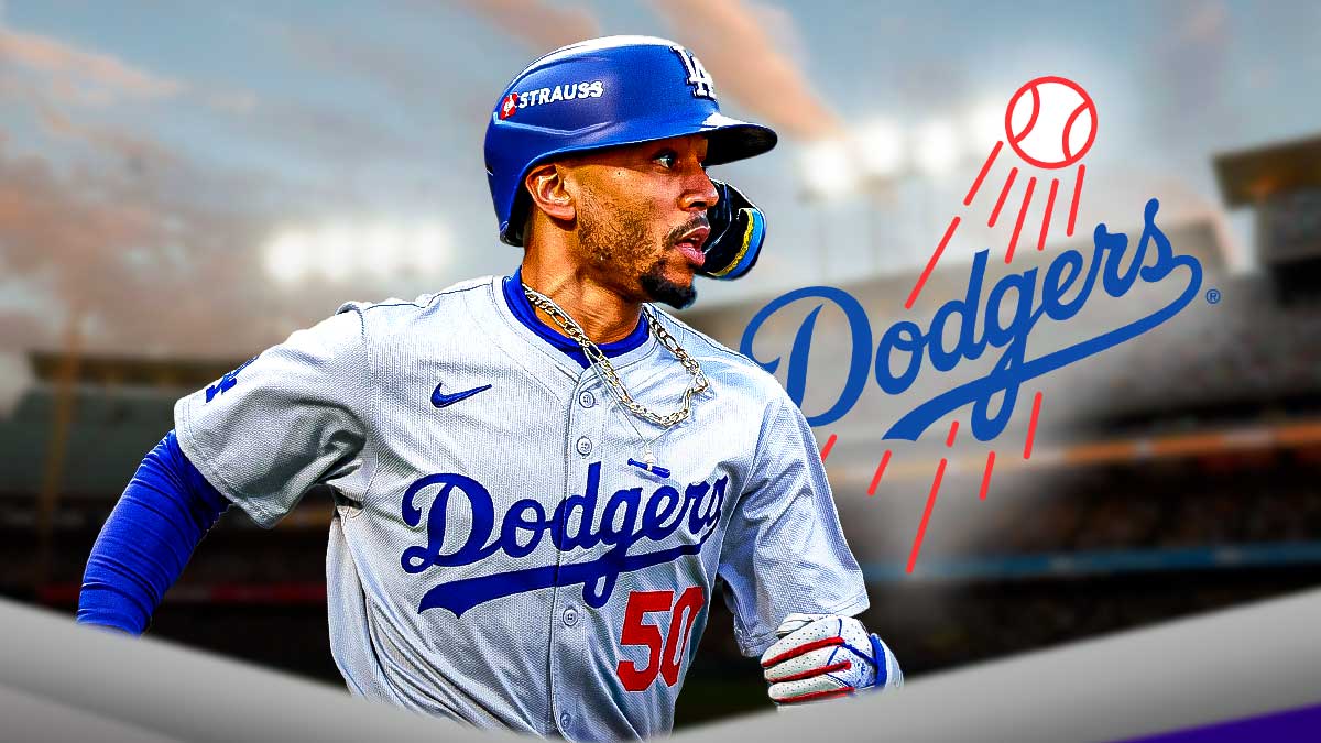 Mookie Betts next to the Dodgers mascot at the Dodgers Stadium.