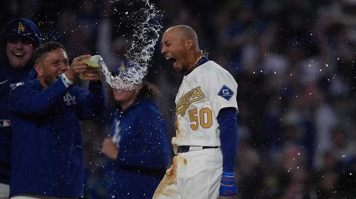 Los Angeles Dodgers shortstop Mookie Betts (50) hits a 3 run home run during the tenth inning against the Detroit Tigers at Dodger Stadium.