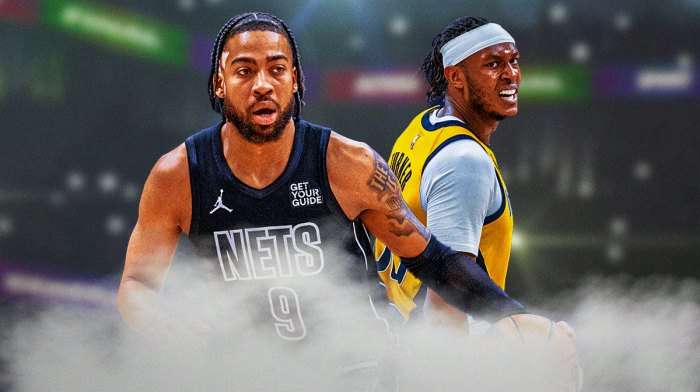 Trendon Watford and Myles Turner with money around them