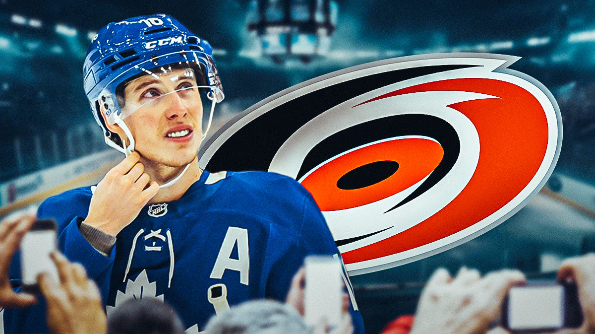 Photo: Mitch Marner in action, Carolina Hurricanes logo beside him