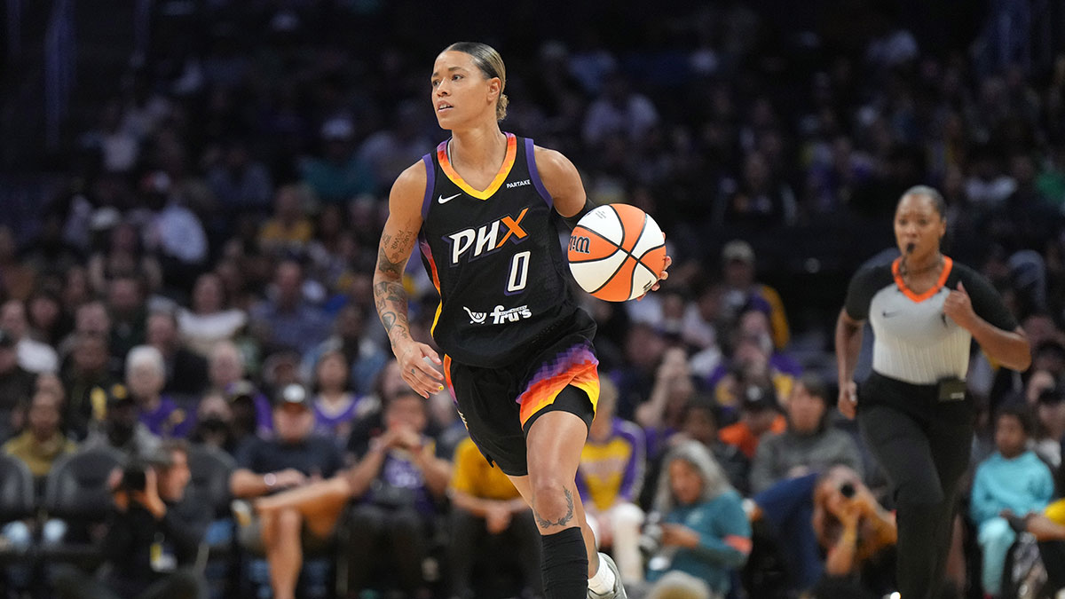 Phoenix Mercury guard Natasha Cloud (0) dribbles the ball against the LA Sparks in the first half at Crypto.com Arena.