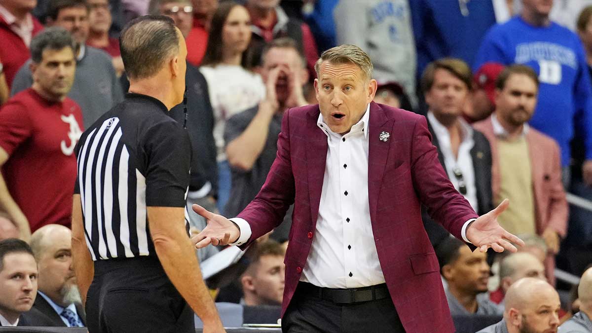 Alabama Crimson Tide head coach Nate Oats talks to a referee during the first half against the Duke Blue Devils in the East Regional final of the 2025 NCAA tournament at Prudential Center. Mandatory Credit: Robert Deutsch-Imagn Images