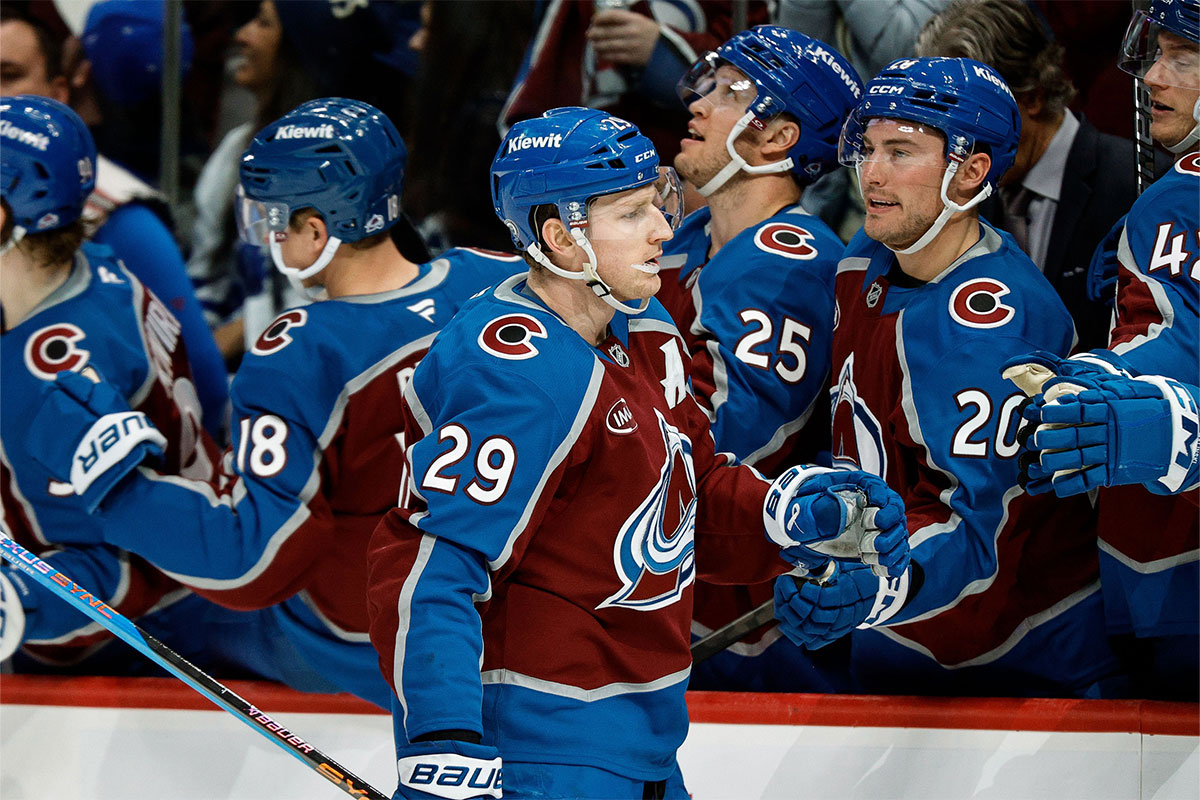 Colorado Avalanche center Nathan MacKinnon (29) celebrates with bench after his goal in the third period against the Toronto Maple Leafs at Ball Arena.