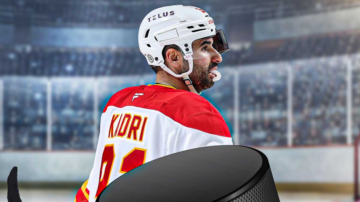 Flames center Nazem Kadri looking hyped with the Flames home arena in the background.
