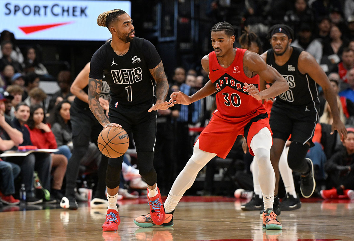 Brooklyn Nets guard D'Angelo Russell (1) dribbles the ball as Toronto Raptors guard Ochai Agbaji (30) defends in the second half at Scotiabank Arena.
