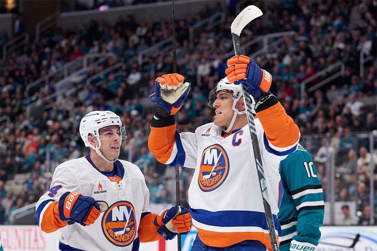 New York Islanders left wing Anders Lee (27) celebrates with center Jean-Gabriel Pageau (44) after scoring a goal against the San Jose Sharks during the third period at SAP Center at San Jose.