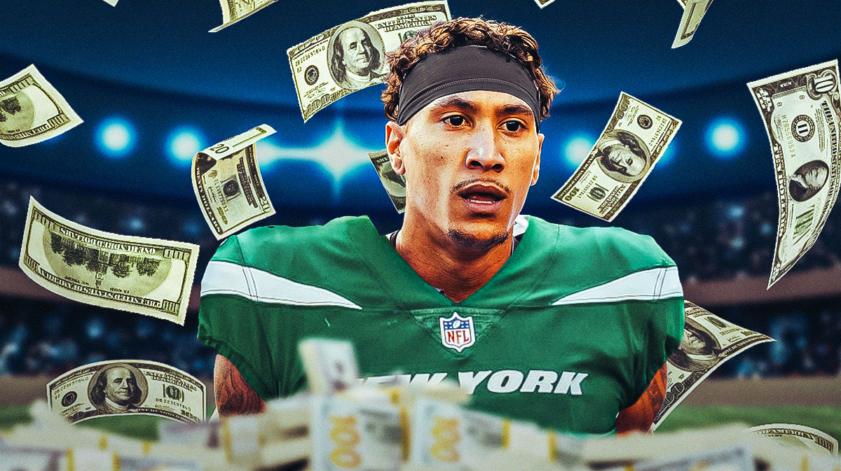 Josh Reynolds in a New York Jets jersey with a bunch of money falling around him