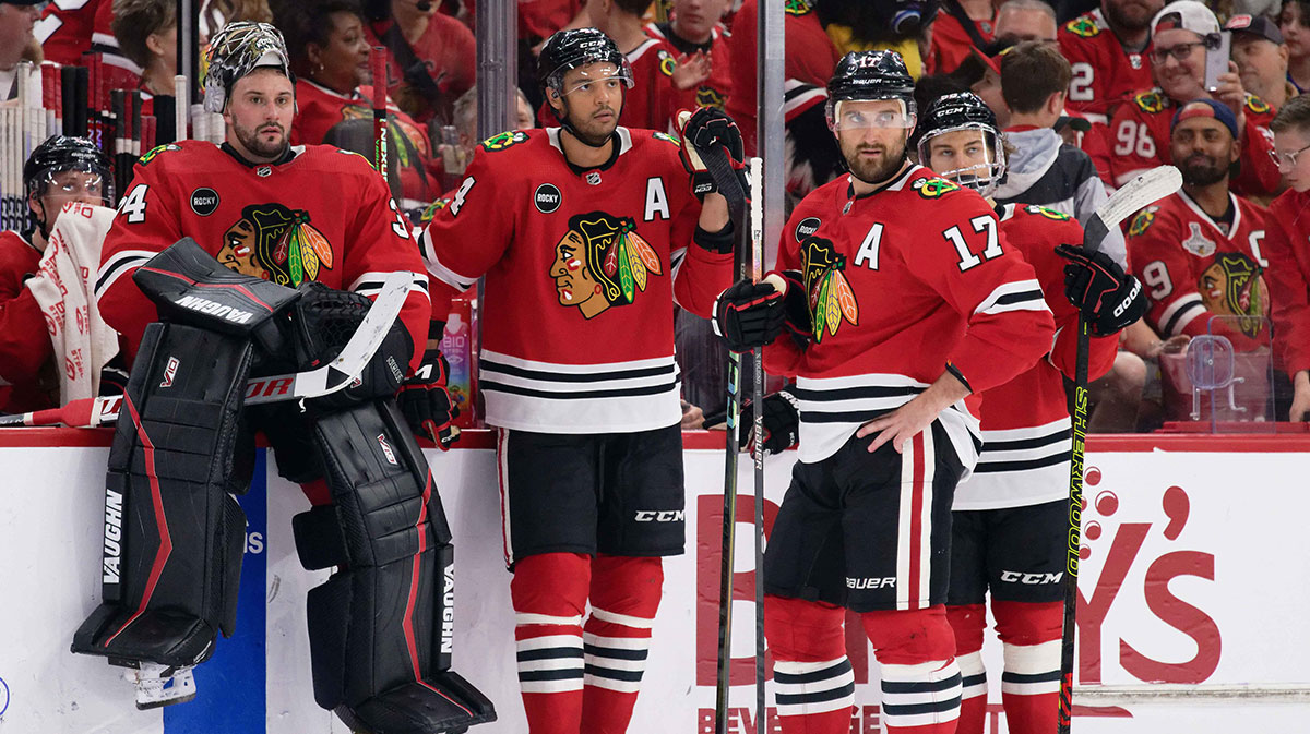 Chicago Blackhawks goaltender Petr Mrazek (34), defenseman Seth Jones (4), forward Nick Foligno (17) and forward Connor Bedard (98) wait for a ruling by the referee during a game against the Carolina Hurricanes at United Center.