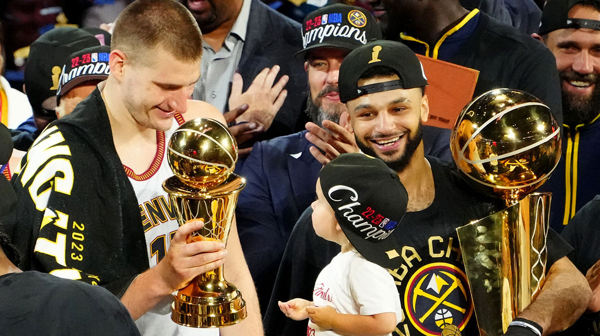 Denver Nuggets Center Nikola Jokic (15) Celebrates the MVP Account Russell NBA, because he holds Larry O'Brien Trophy after Nuggets won 2023. NBA Championship against Miami Heat on Ball Arena.