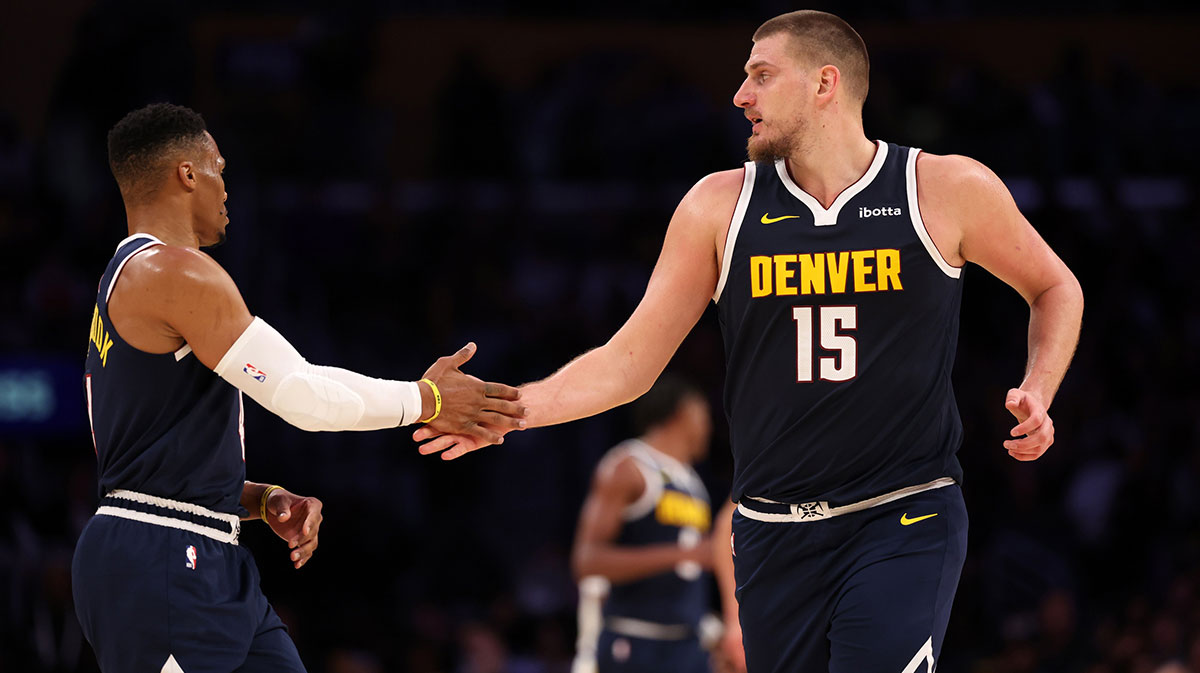 Denver Nuggets Center Nikola Jokic (15) Hug Gussell Westbrook (4) During the third quarter to Los Angeles Lakers at the Cripto.com Arena. 