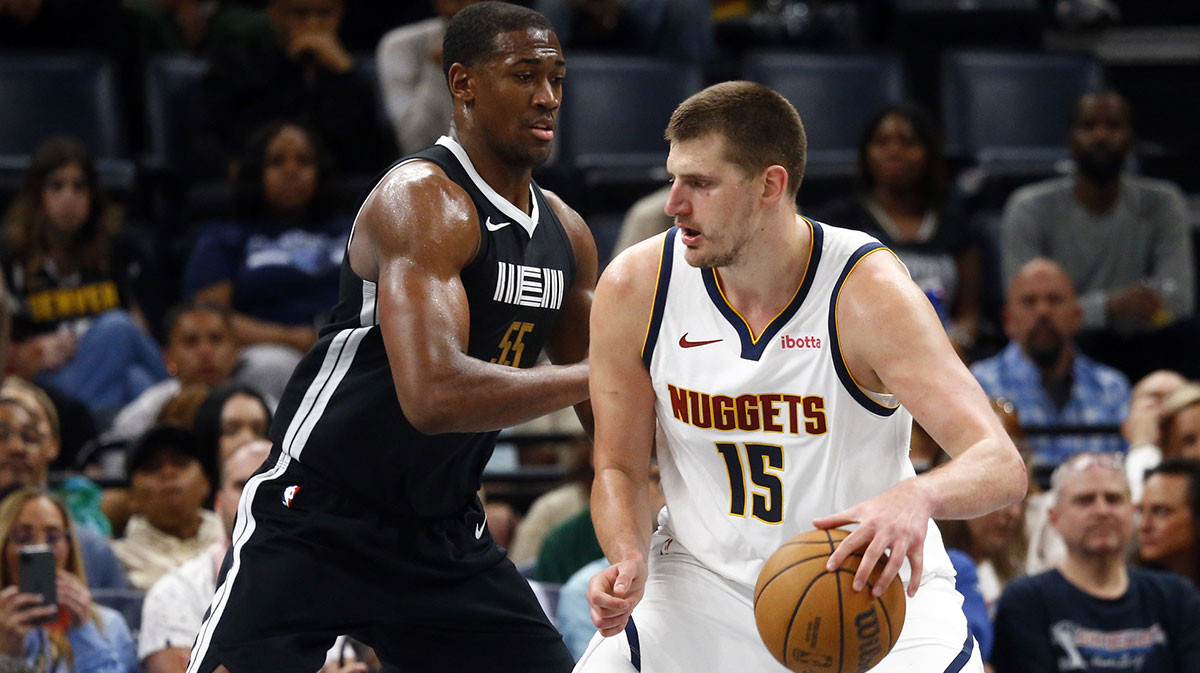 Denver Nuggets Center Nikola Jokić (15) Dribbles AS Memphis Grizzlies Center Trei Jemison (55) Defend during the second half in FedExforum.