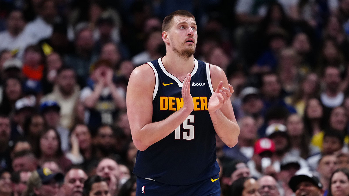 Denver Nuggets center Nikola Jokic (15) reacts in the third quarter against the Utah Jazz at Ball Arena. 