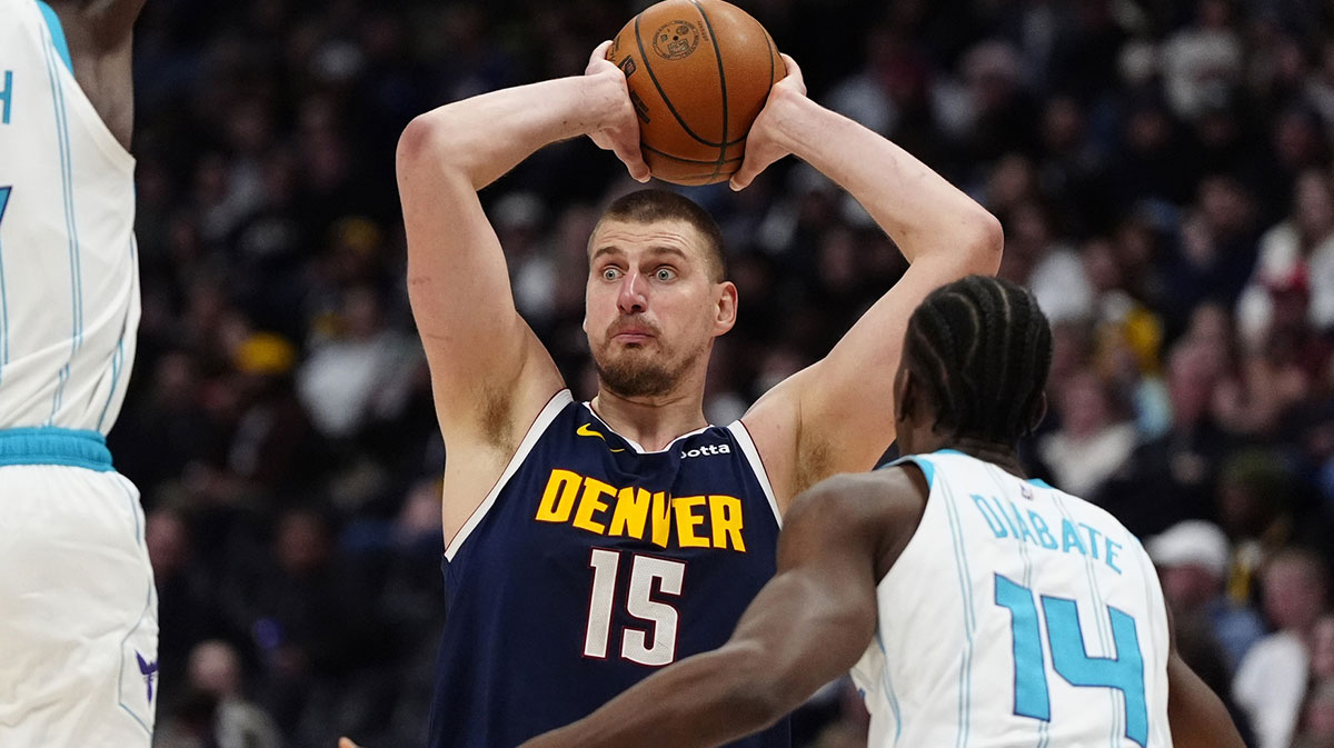 Denver Nuggets Center Nikola Jokić (15) is prepared for the passage of the ball via Charlotte Hornets Next Moussa Diabate (14) in the second half at the ballley Arena.