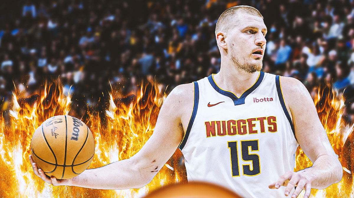 Photo: Nikola Jokic in action in Nuggets jersey with fire around him