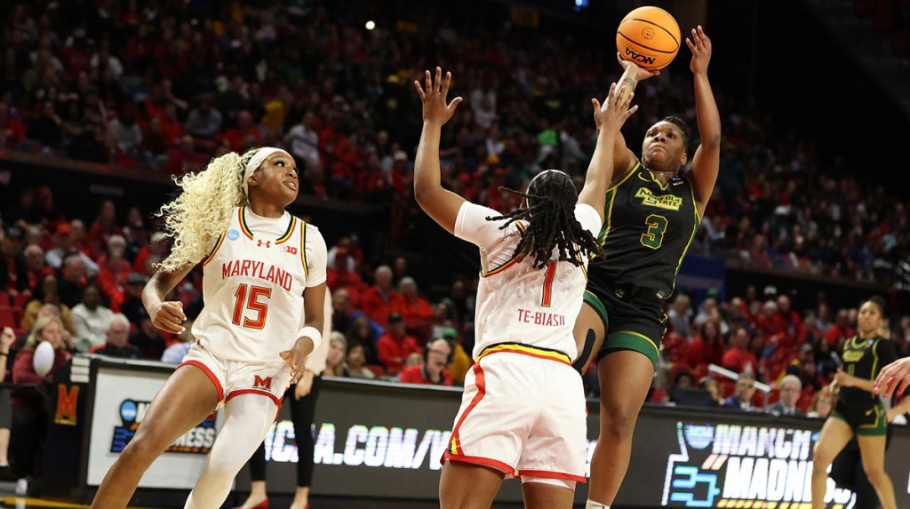 Norfolk State Spartans guard Diamond Johnson (3) takes a shot over Maryland Terrapins forward Christina Dalce (15) and guard Sarah Te-Biasu (1) during the first half.