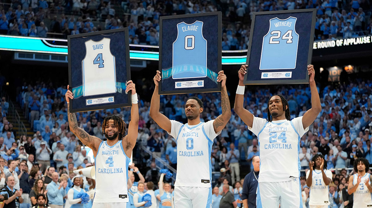 Mar 8, 2025; Chapel Hill, North Carolina, USA; North Carolina Tar Heels guard RJ Davis (4)forward Ty Claude (0) and forward Jae'Lyn Withers (24) are recognized before the game at Dean E. Smith Center. Mandatory Credit: Bob Donnan-Imagn Images