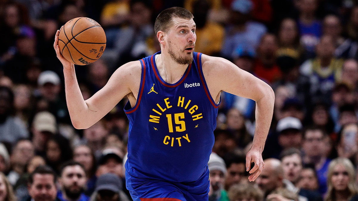 Nuggets center Nikola Jokic (15) looks to pass the ball in the second quarter against the Sacramento Kings at Ball Arena