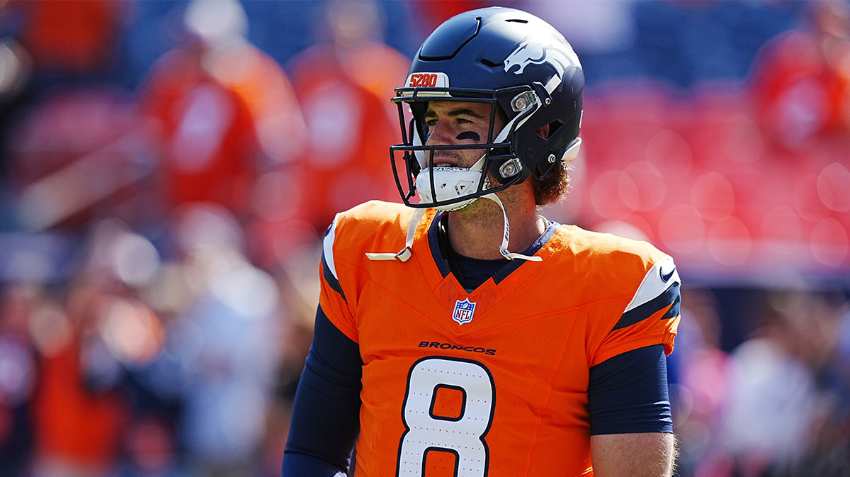 Denver Broncos quarterback Jarrett Stidham (8) warms up before the game against the Los Angeles Chargers at Empower Field at Mile High. 