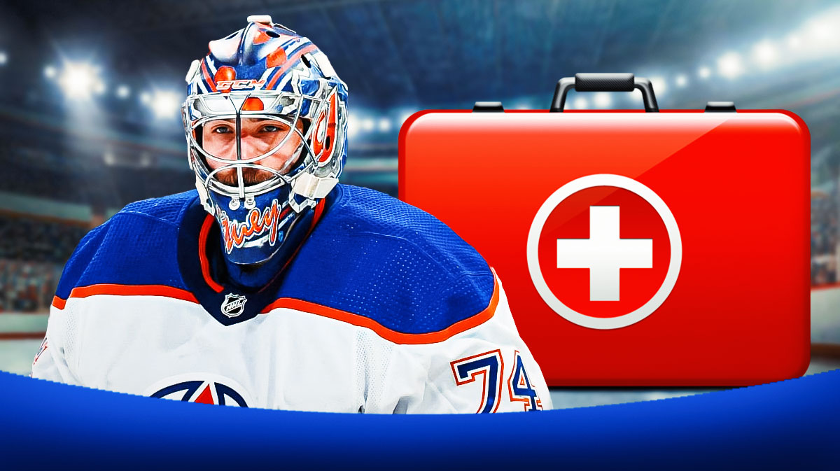 Stuart Skinner looking stern, first aid kit, hockey rink in background Edmonton Oilers