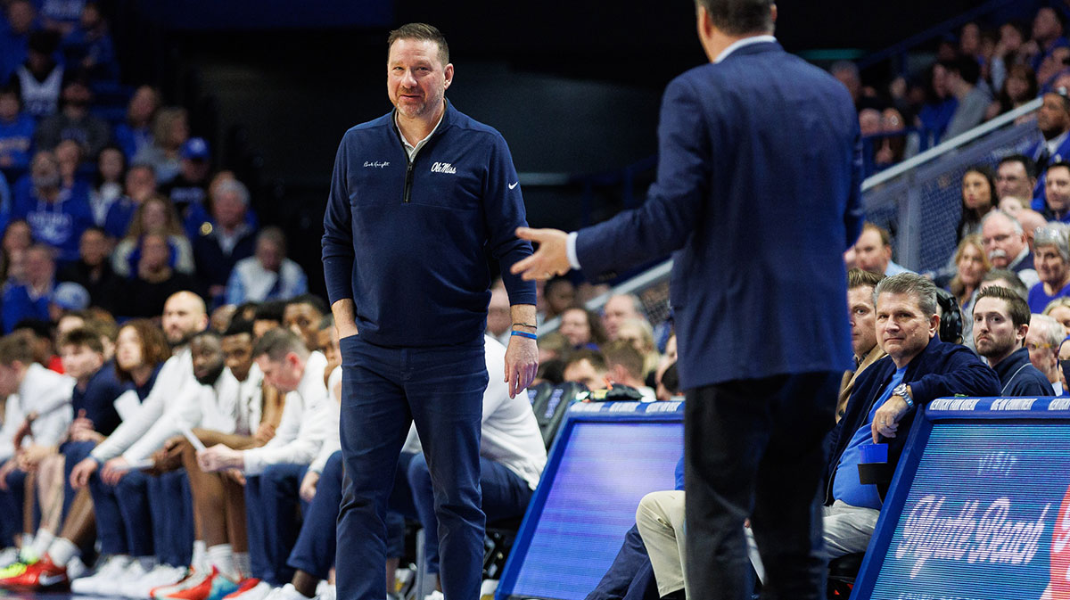 Kentucky Wildcats head coach John Calipari and Ole Miss Rebels head coach Chris Beard talk on the sideline during the second half at Rupp Arena at Central Bank Center.