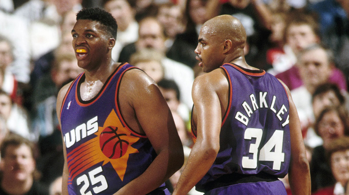 Phoenix Suns forward Charles Barkley (34) talks to Oliver Miller (25) against the Portland Trail Blazers at Memorial Coliseum. 