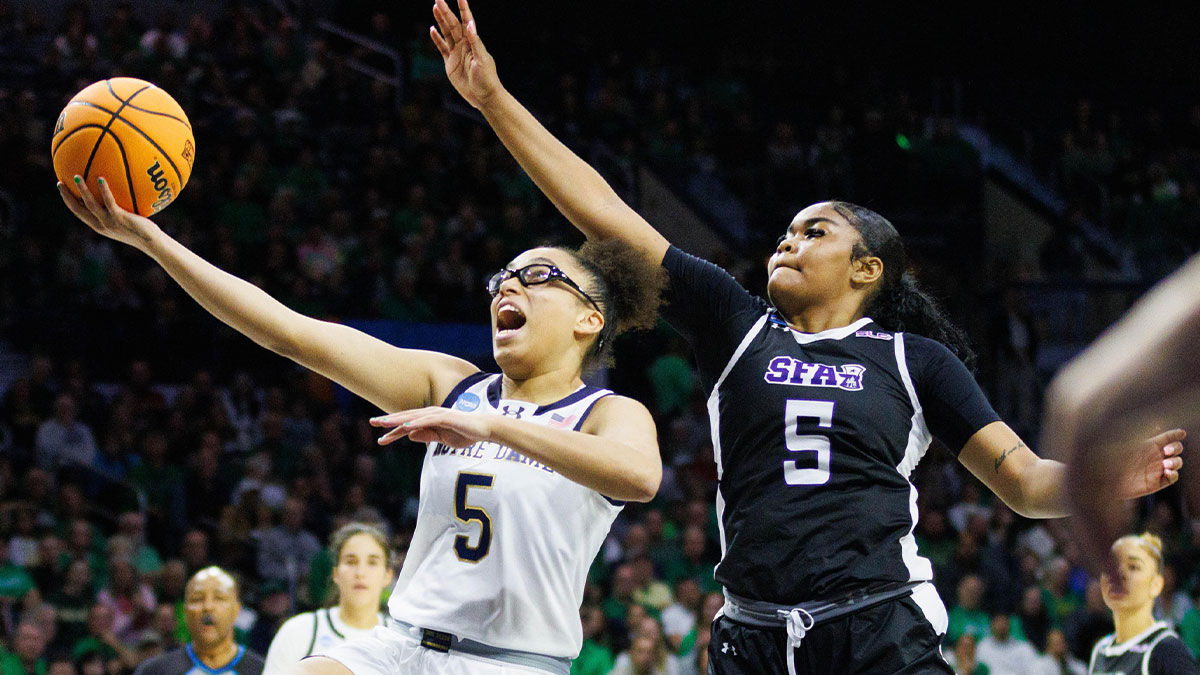 Notre Dame guard Olivia Miles, left, drives to the basket during the first round of the NCAA Women's Basketball Tournament between Notre Dame and Stephen F. Austin at Purcell Pavilion on Friday, March 21, 2025, in South Bend.