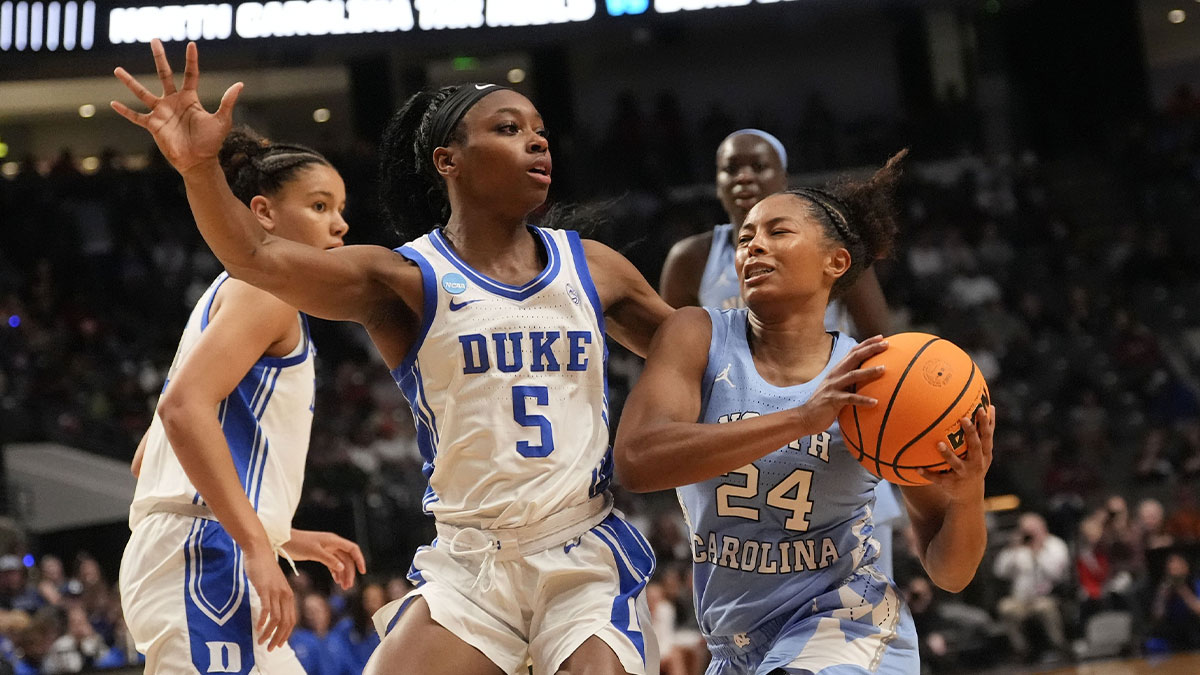 Duke Blue Devils guard Oluchi Okananwa (5) defends a drive by North Carolina Tar Heels guard Indya Nivar (24) at Legacy Arena.