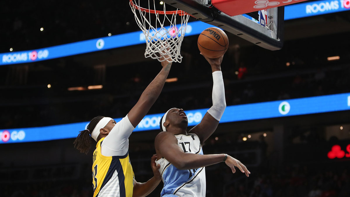 Atlanta Hawks forward Onyeka Okongwu (17) goes to the basket against Indiana Pacers center Myles Turner (33) during the first quarter at State Farm Arena. 