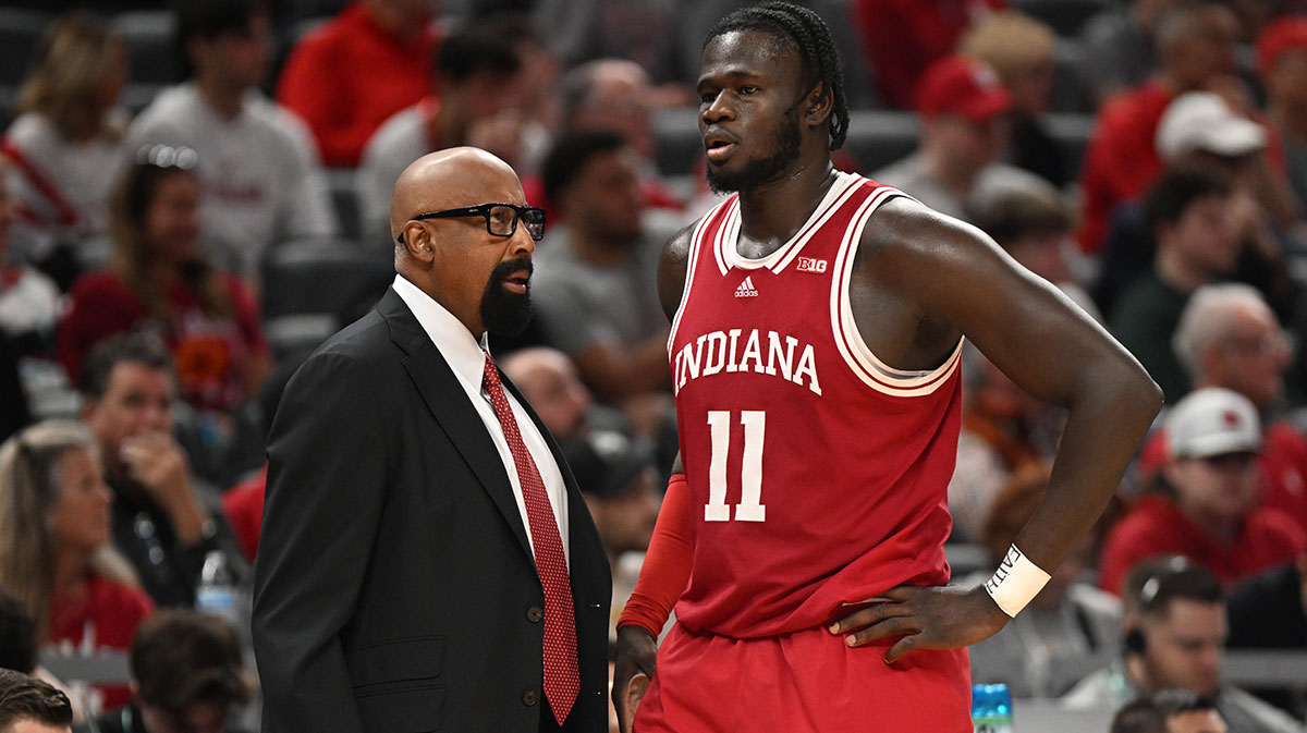 Indiana Hoosiers head coach Mike Woodson talks with Indiana Hoosiers center Oumar Ballo (11) during the second half against the Oregon Ducks at Gainbridge Fieldhouse. 