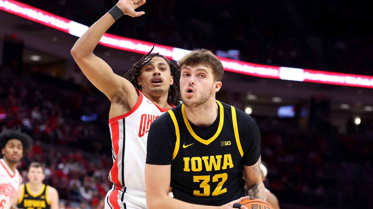 Iowa Hawkeyes forward Owen Freeman (32) controls the ball as Ohio State Buckeyes forward Devin Royal (21) defends during the first half at Value City Arena.