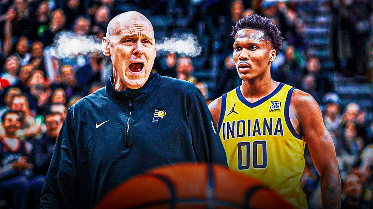 Pacers head coach Rick Carlisle, and steam coming out of his ears, and Bennedict Mathuerin standing next to him.