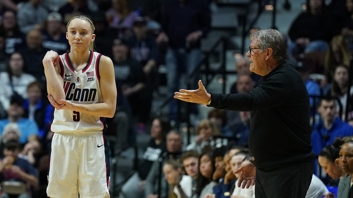 UConn Huskies head coach Geno Auriemma talks to guard Paige Bueckers (5) from the sideline as they take on the St. John's Red Storm at Mohegan Sun Arena.