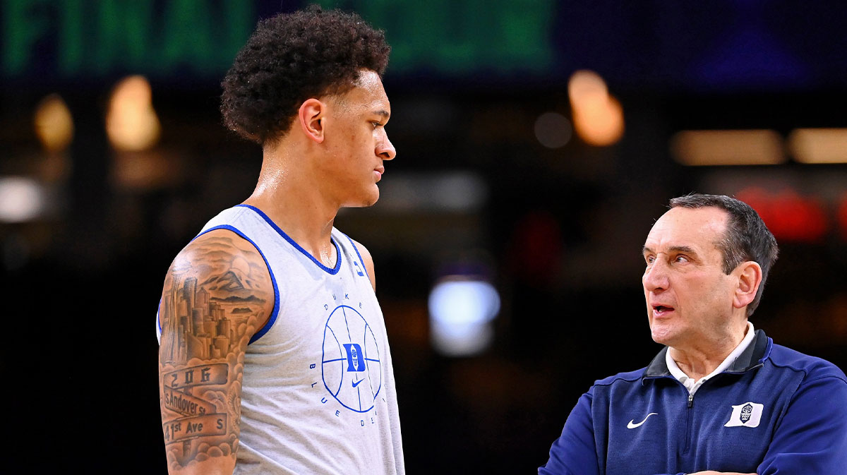 Duke Blue Devils head coach Mike Krzyzewski talks to forward Paolo Banchero (5) during a practice session before the 2022 NCAA men's basketball tournament Final Four semifinals at Caesars Superdome.