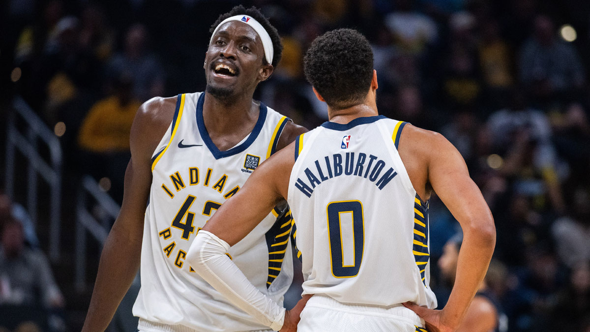 Indiana Pacens attack Pascal Siakam (43) and Indiana Pacers Guard Tires Haliburton (0) in the second half against Orlando magic at Gainbridge Fieldhouse. 