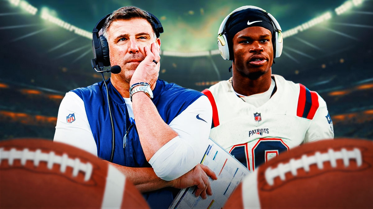 Patriots head coach Mike Vrabel with Travis Hunter in a Patriots jersey next to him.