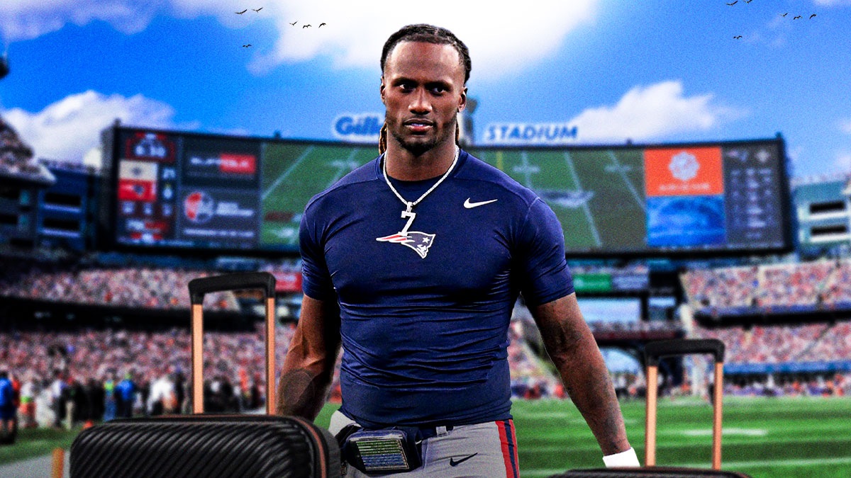 Joe Milton III holding large suitcases in front of the Patriots stadium.