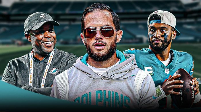 Tua Tagvailoa, coach Mike McDaniel, GM Chris Grier all beside each other, Miami Dolphins wallpaper in the background