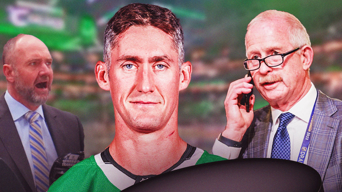 New York Islanders center Brock Nelson skating (with jersey swap to the Dallas Stars), Dallas Stars general manager Jim Nill talking and/or on phone on left side, Dallas Stars head coach Peter DeBoer coaching and/or talking on right side, American Airlines Center (home arena of the Dallas Stars) in background