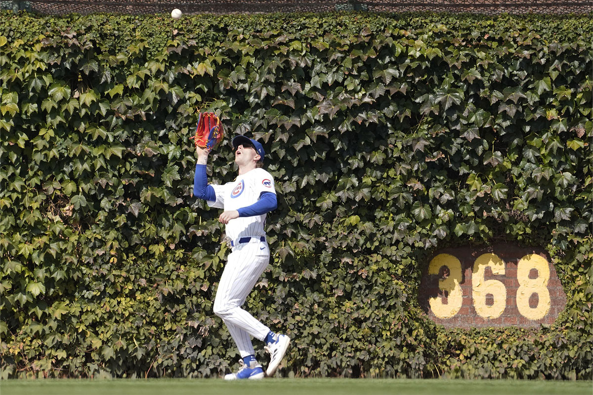 Chicago Cubs outfielder Pete Crow-Armstrong (52) makes a catch on Washington Nationals catcher Drew Millas (not pictured) during the fourth inning at Wrigley Field. 